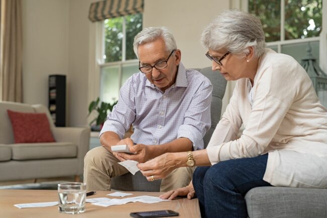 Senior couple preparing taxes Senior couple preparing taxes